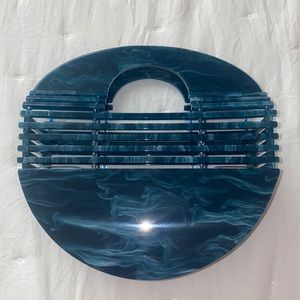 Crescent acrylic handbag
